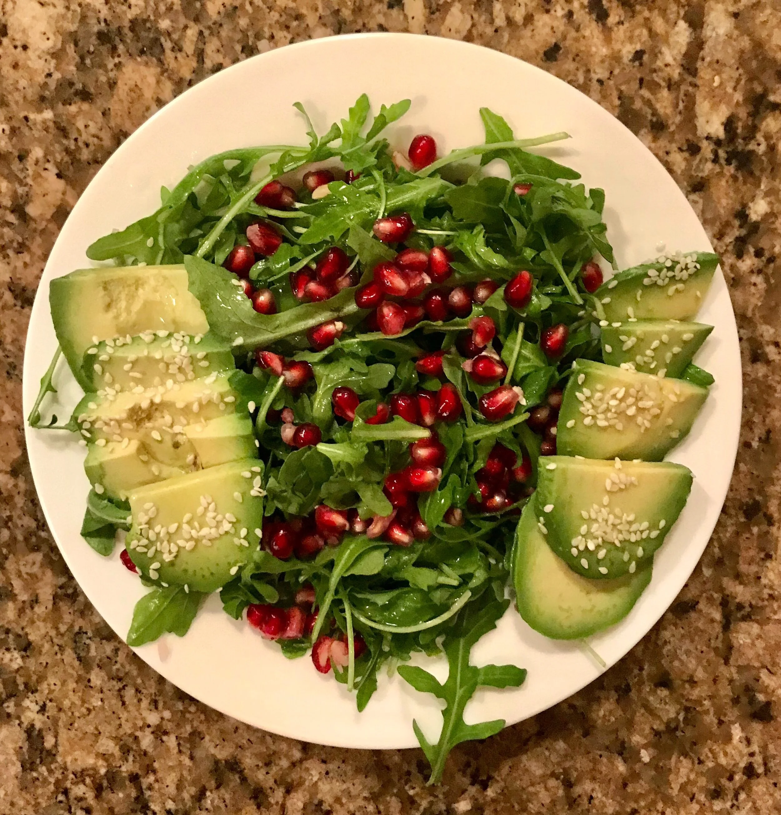Arugula Salad with Avocado, Pomegranate, and Sesame Seeds