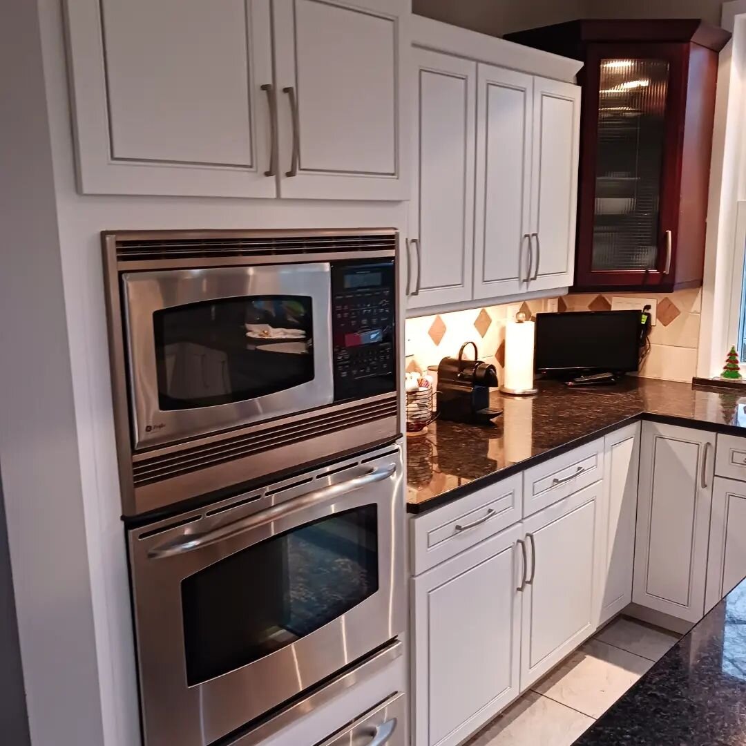 Tired of that wood look in your kitchen? Recently completed kitchen cabinet refiishing from wood look to bright white. PriTired of that wood look in your kitchen? Recently completed kitchen cabinet refiishing from wood look to bright white. Primed wi