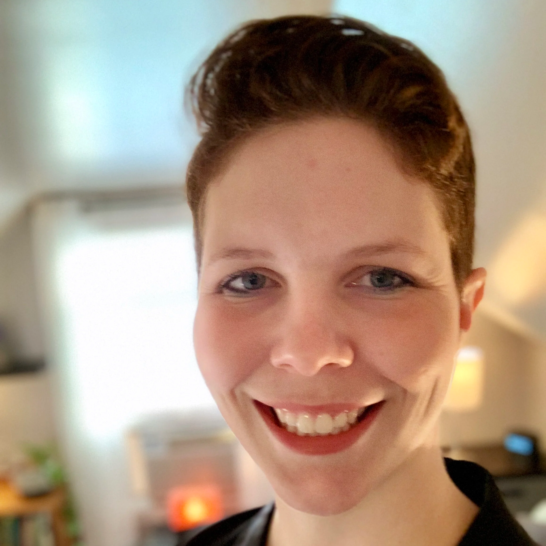 Erin Pickney, LCSW smiles welcomingly.