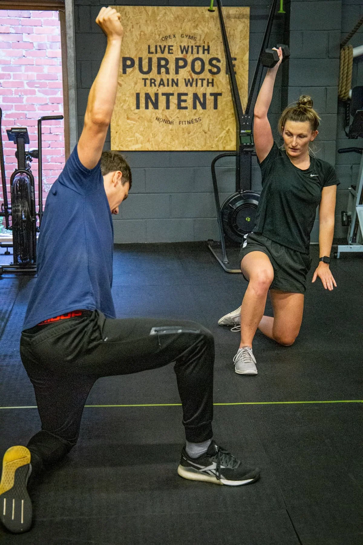 Personal trainer Milo refining a training program with client