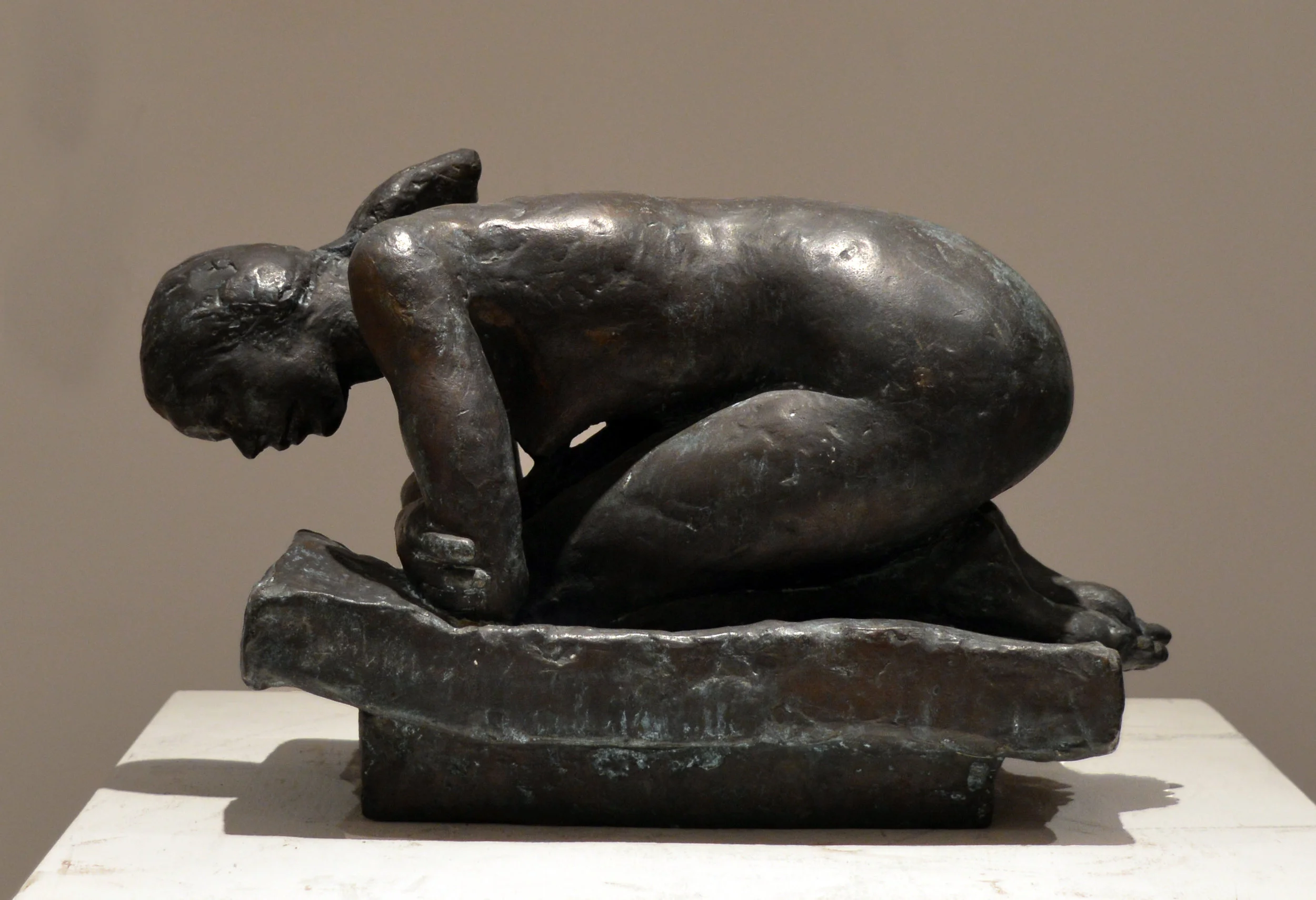 12. Curled Female Nude on Bed
