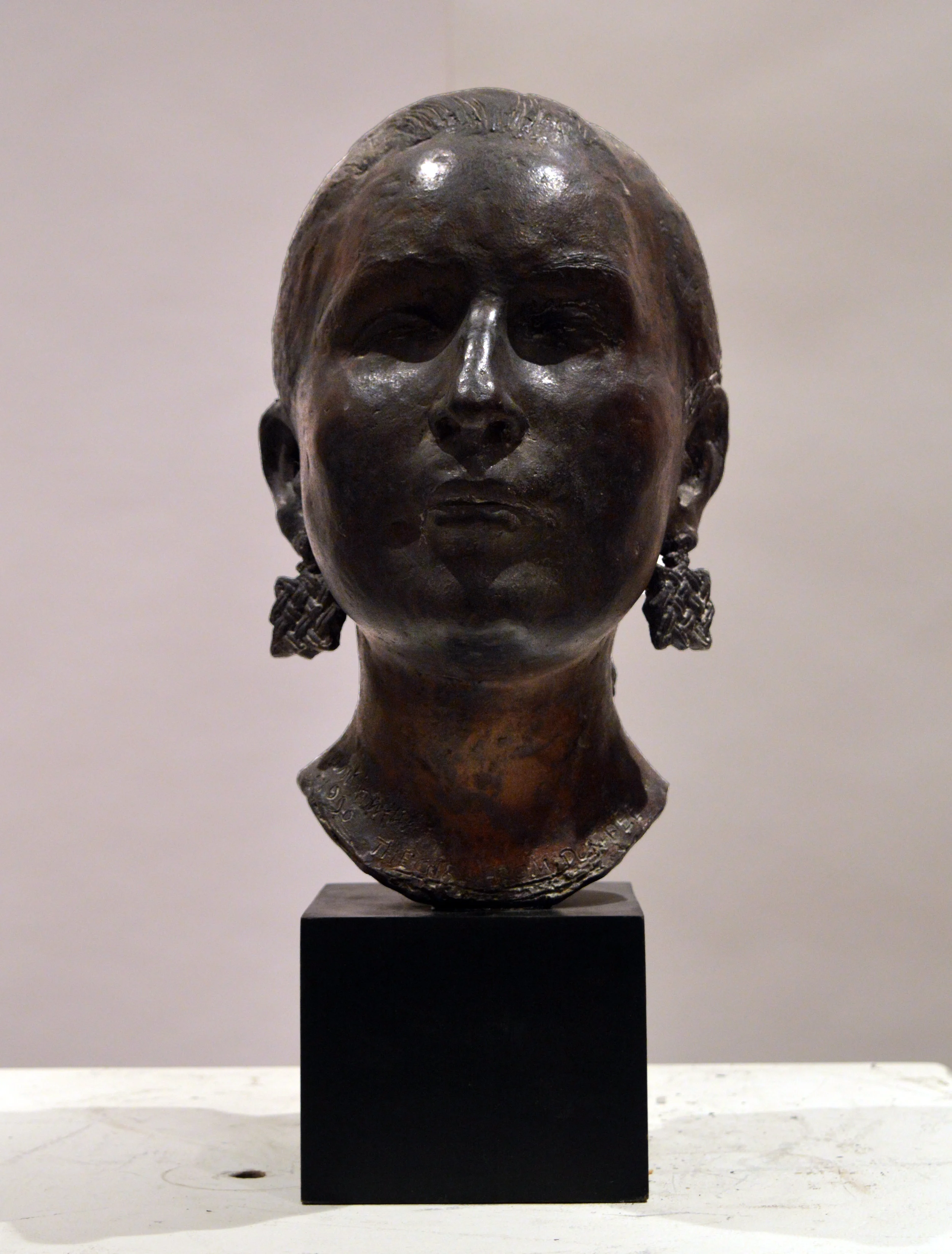 65. Woman's Head with earrings