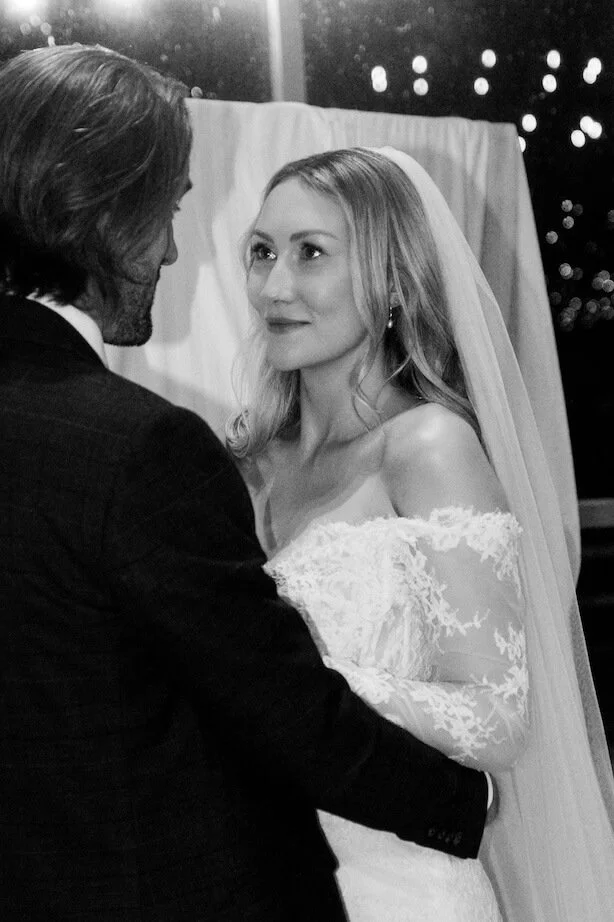 wife looking at husband photography