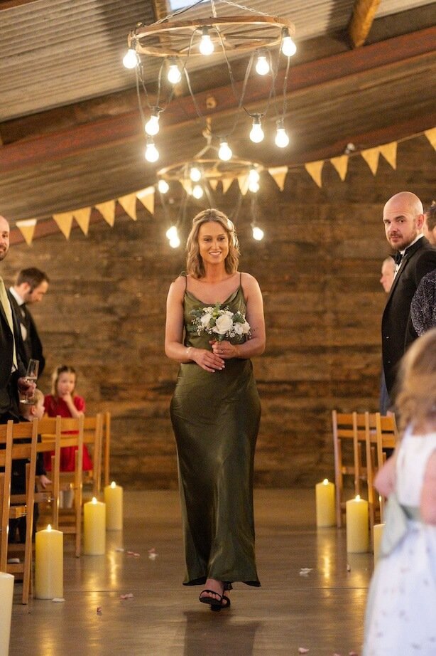 bridesmaid walking down the aisle