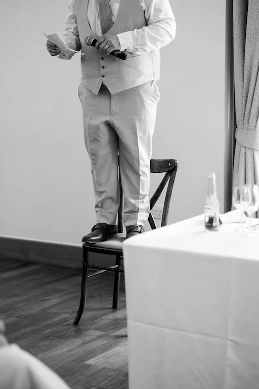 man standing on chair