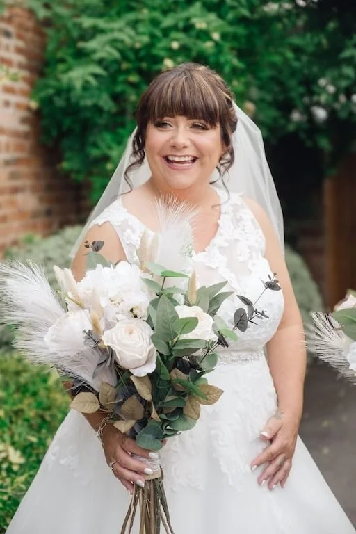 bride holding flowers