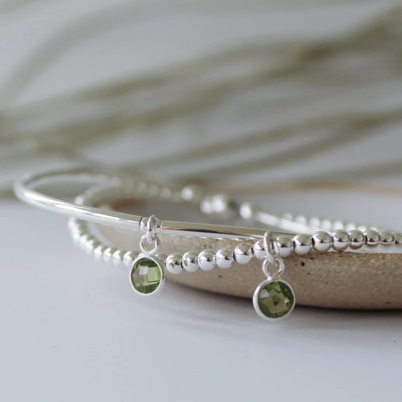 Silver bracelets with peridot multi.JPG