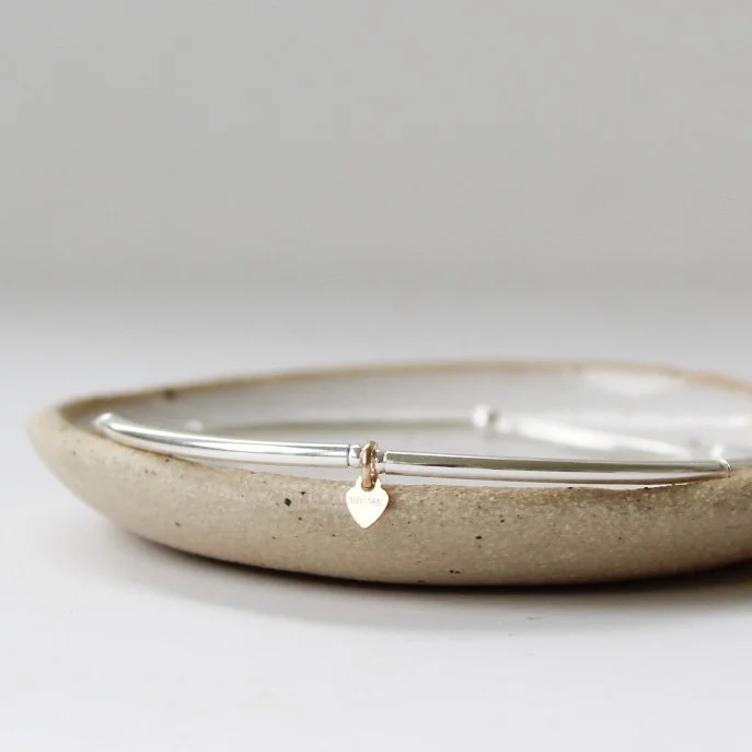 silver stacking with tiny gold heart.JPG