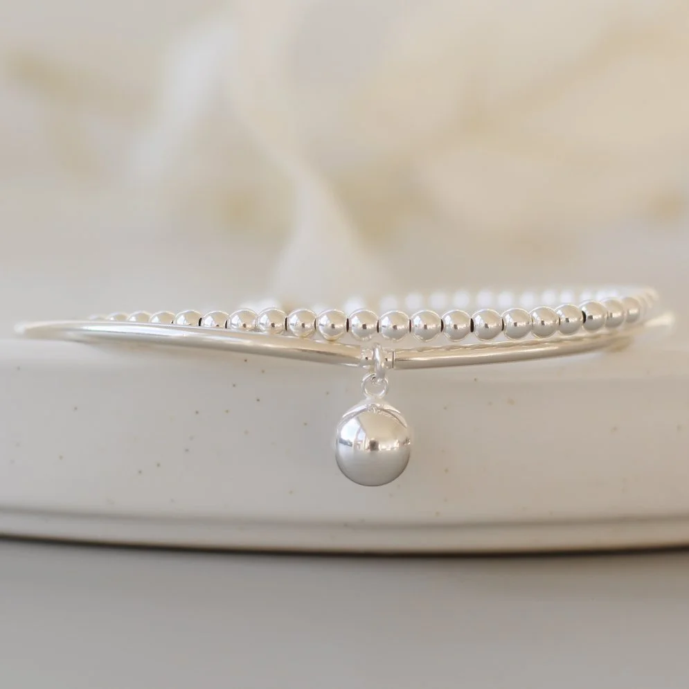 Silver double wrap bracelet with dangly ball