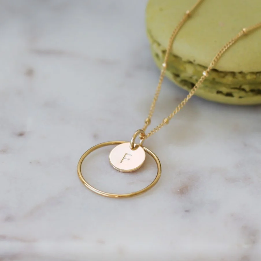 Gold hand stamped initial in a halo necklace