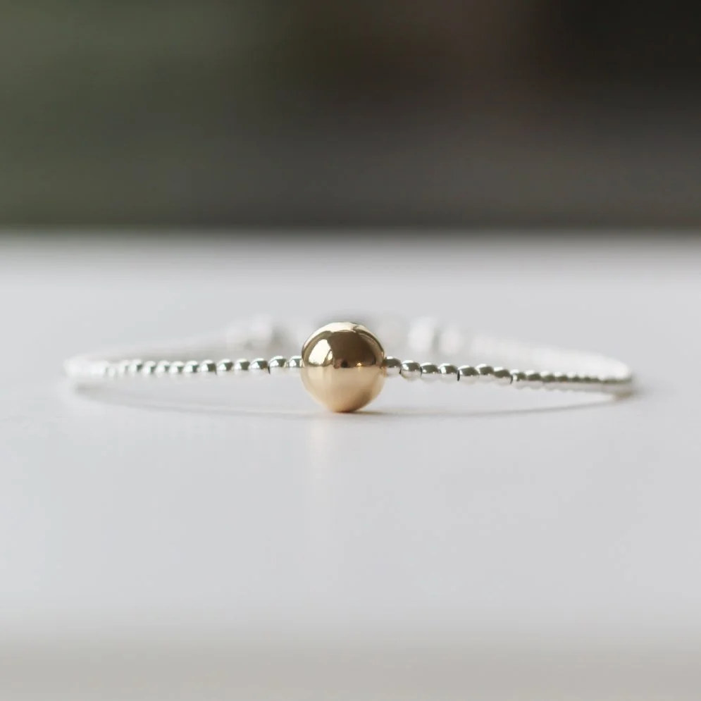 silver dainty bracelet with large gold filled ball.JPG