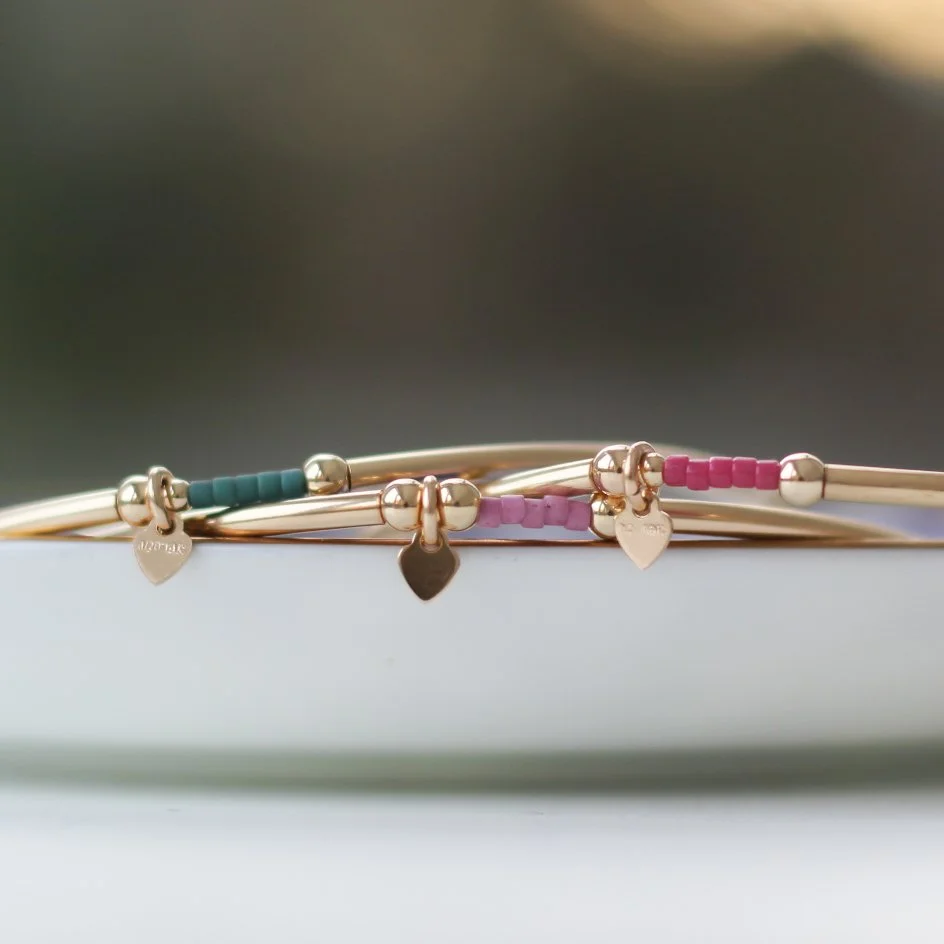 gf teal, raspberry, mauve bracelets.JPG