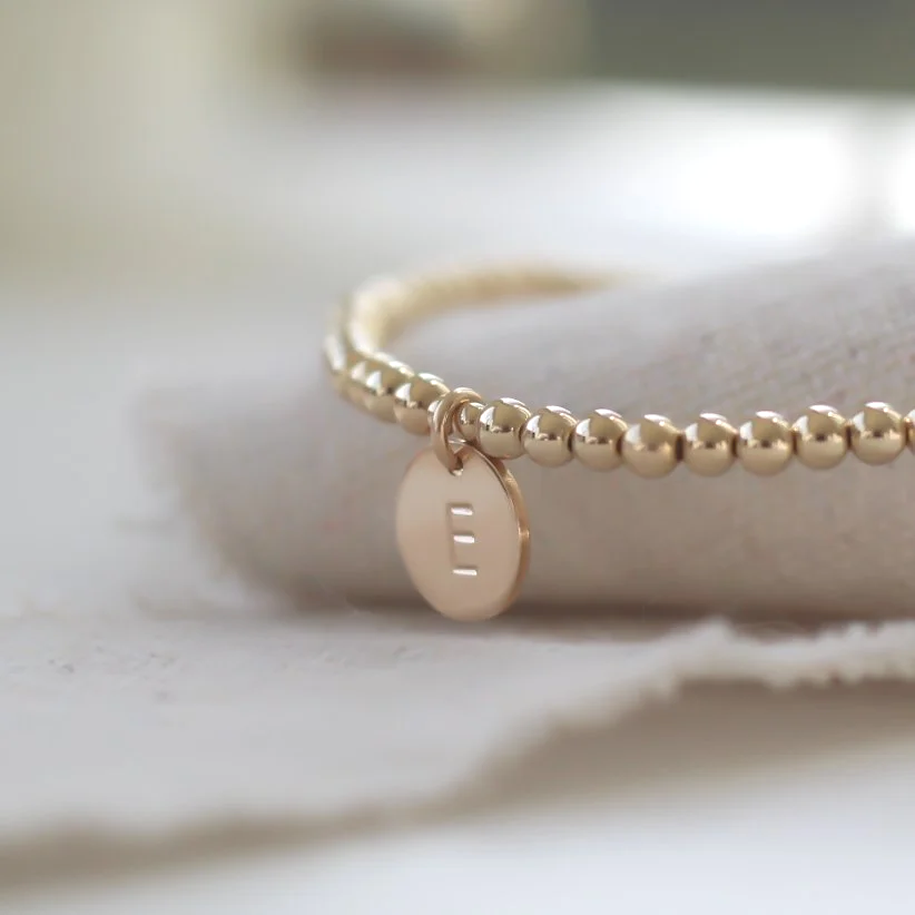 Gold filled stacking bracelet with hand stamped initial