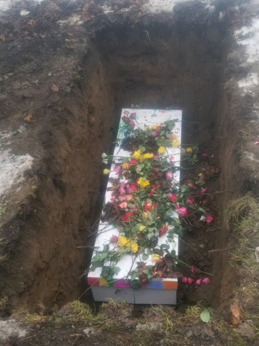 Mitchell-Funeral-Green-Burial-outdoor-casket-flowers.jpg