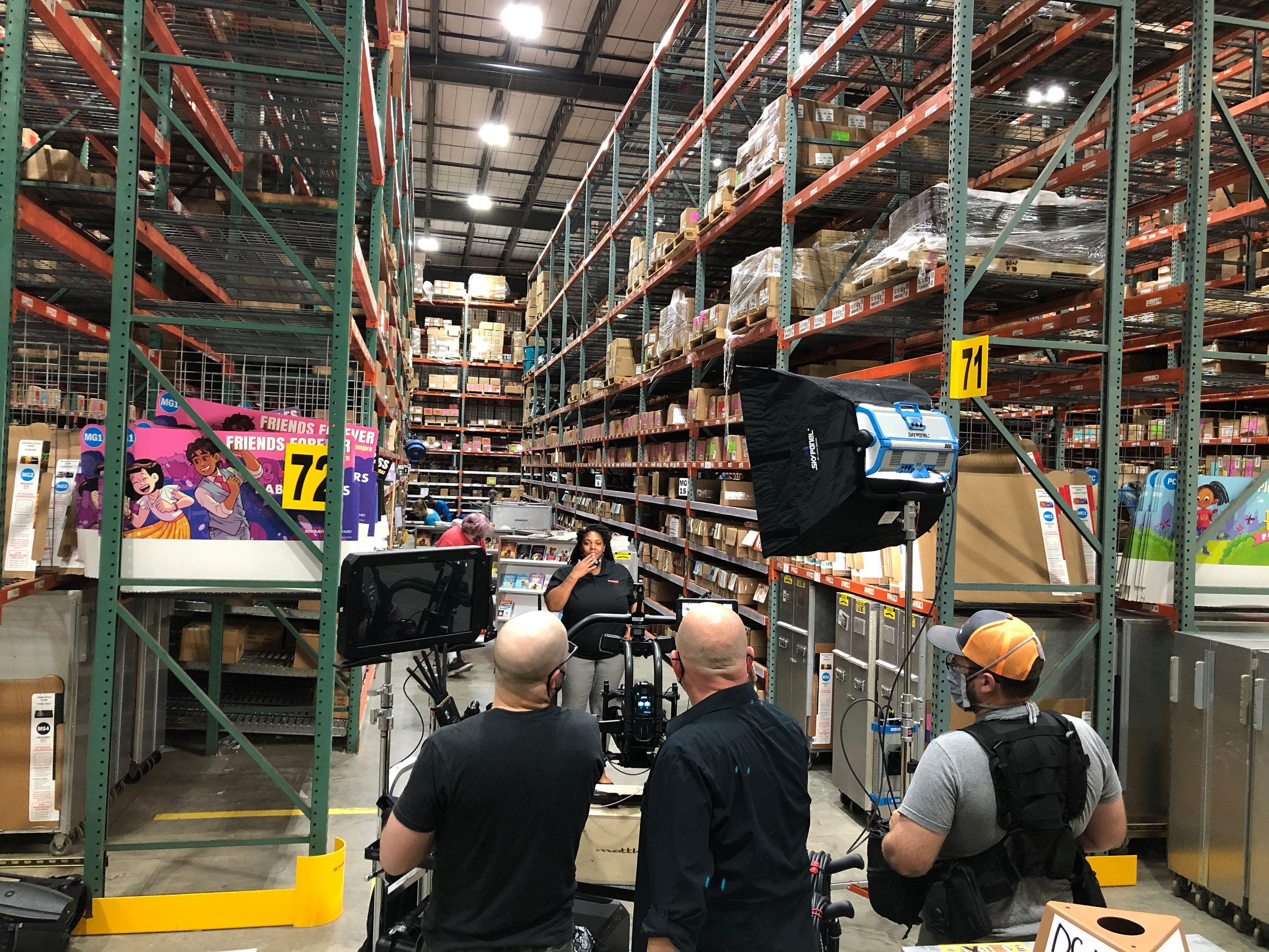  Cameras and lights set up for video production in a warehouse 