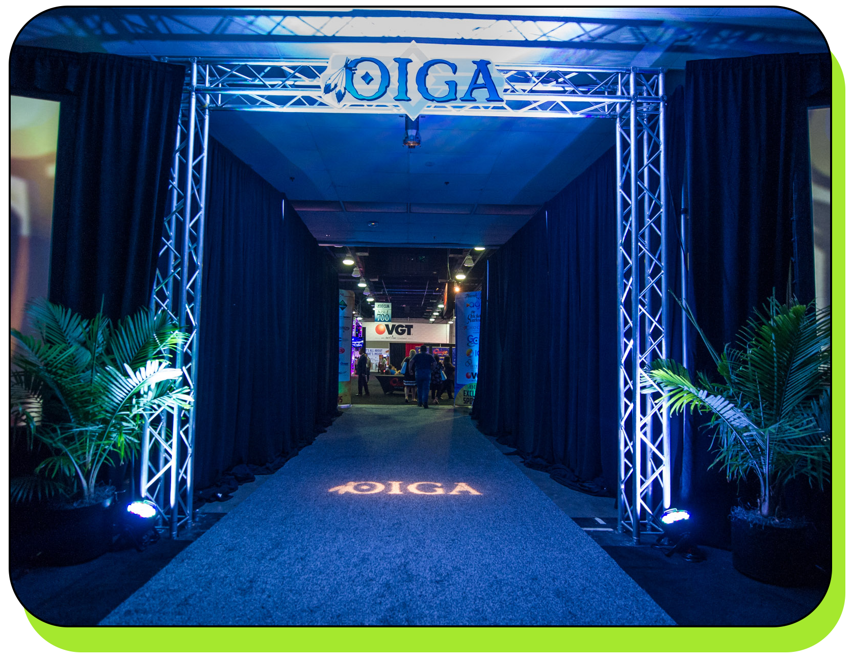 Conference entrance hallway with black pipe and drape, a truss goal post and uplighting