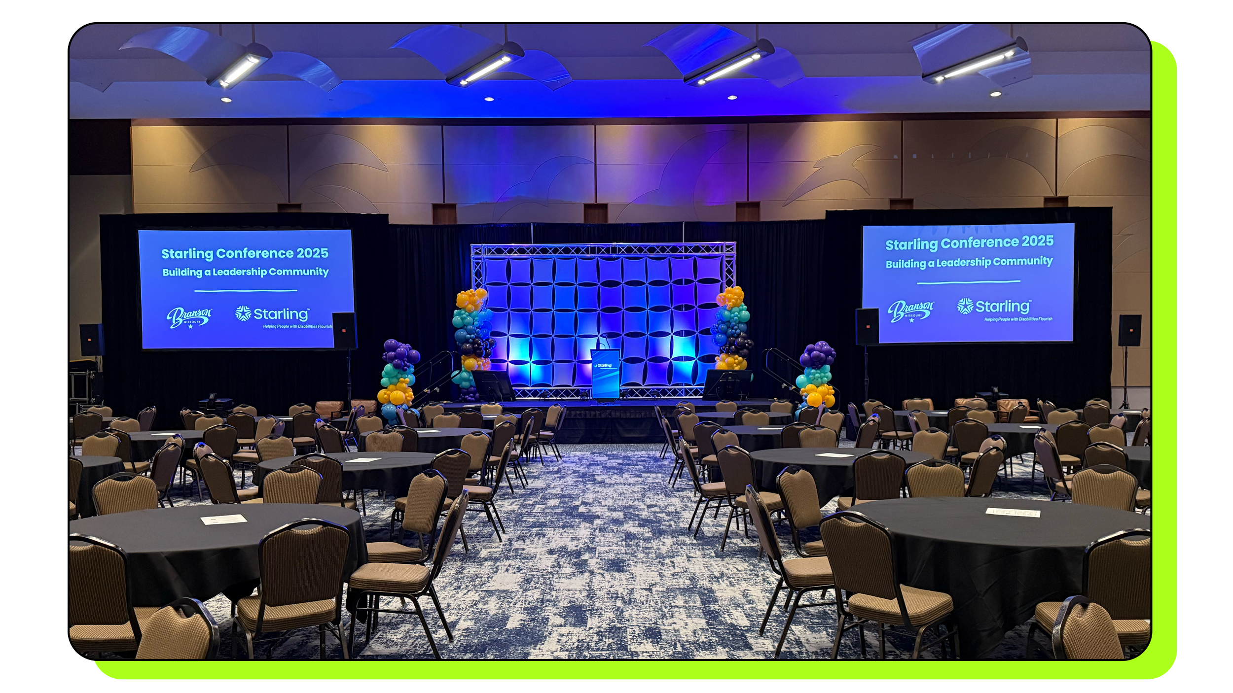 Stage design with truss structure and large sixteen foot projection screens