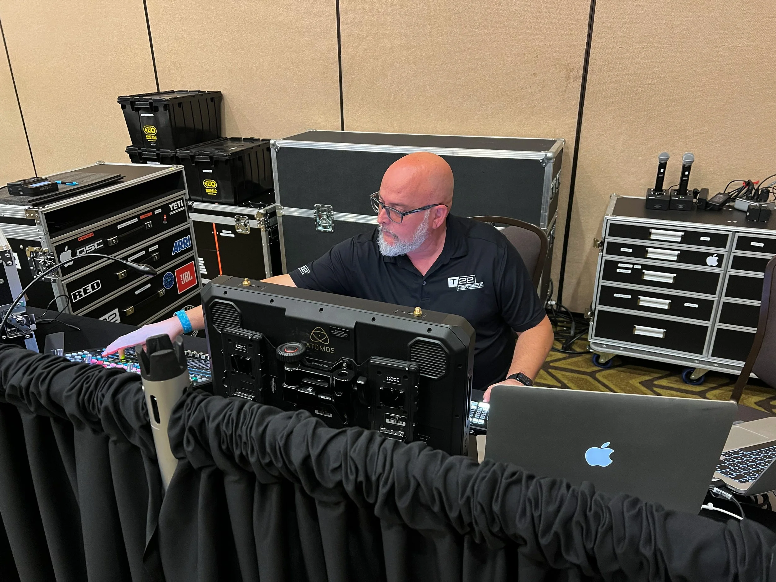 audio and video technician adjusting the audio levels during a conference at Lake of the Ozarks Missouri