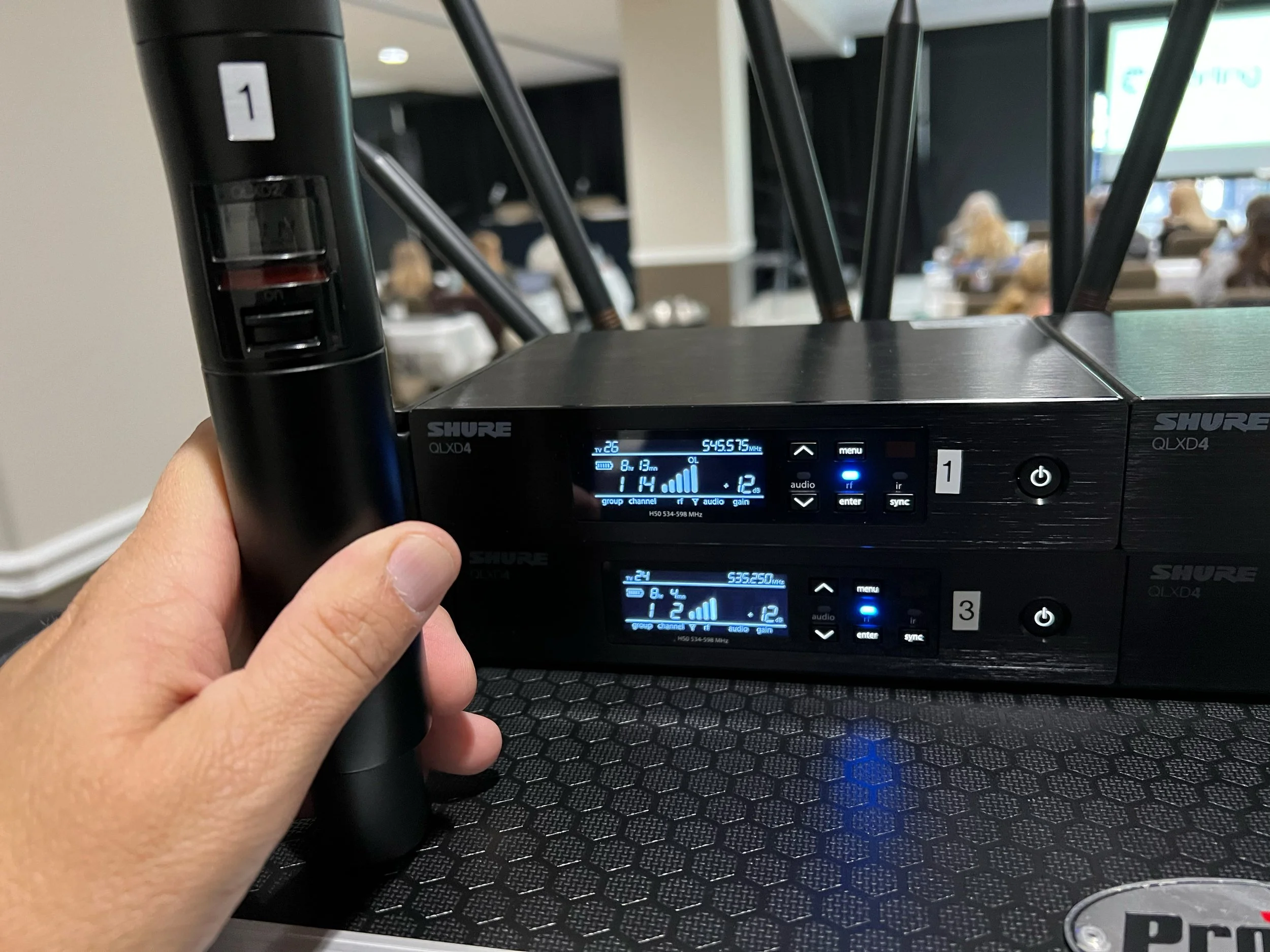 Close up view of a wireless microphone and receiver setup for a breakout room in Lake of the Ozarks Missouri