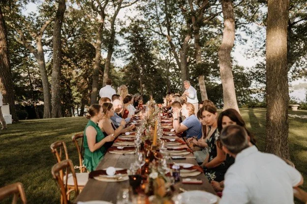 Guest comfort details like drink stations and shade are essential for summer outdoor events.
