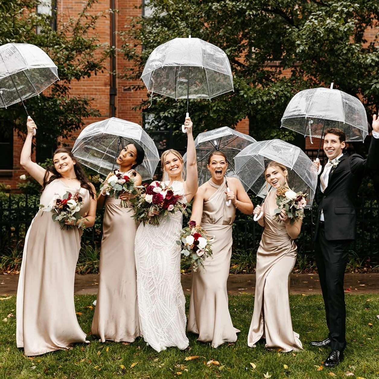 Wedding party enjoying the rain in Minnesota