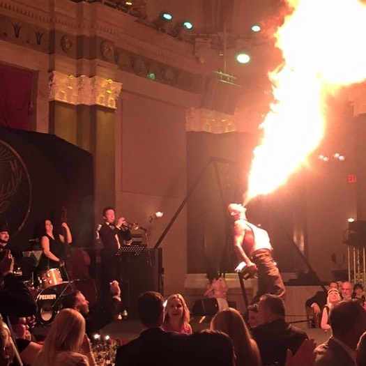 Flambeaux breathes fire for the crowd to gasp at.....