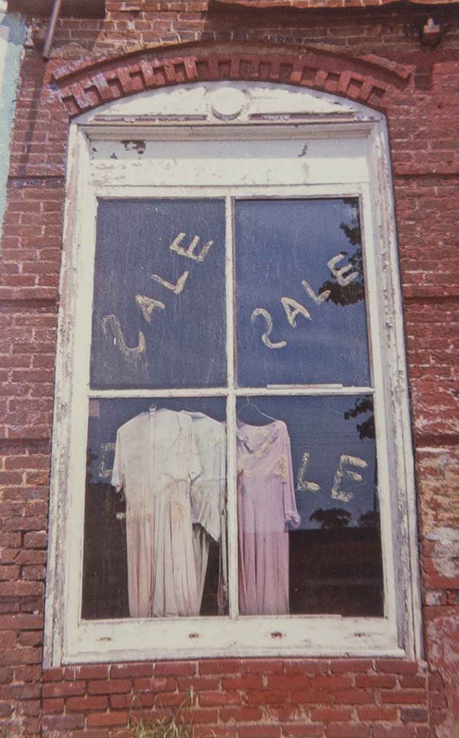   Window with Sale Dresses, Uniontown, Alabama  Image: 1974/printed: 1981 Dye Coupler Color Print 5 x 3 1/4 in. (image size) The Do Good Fund, Inc., 2016-119 