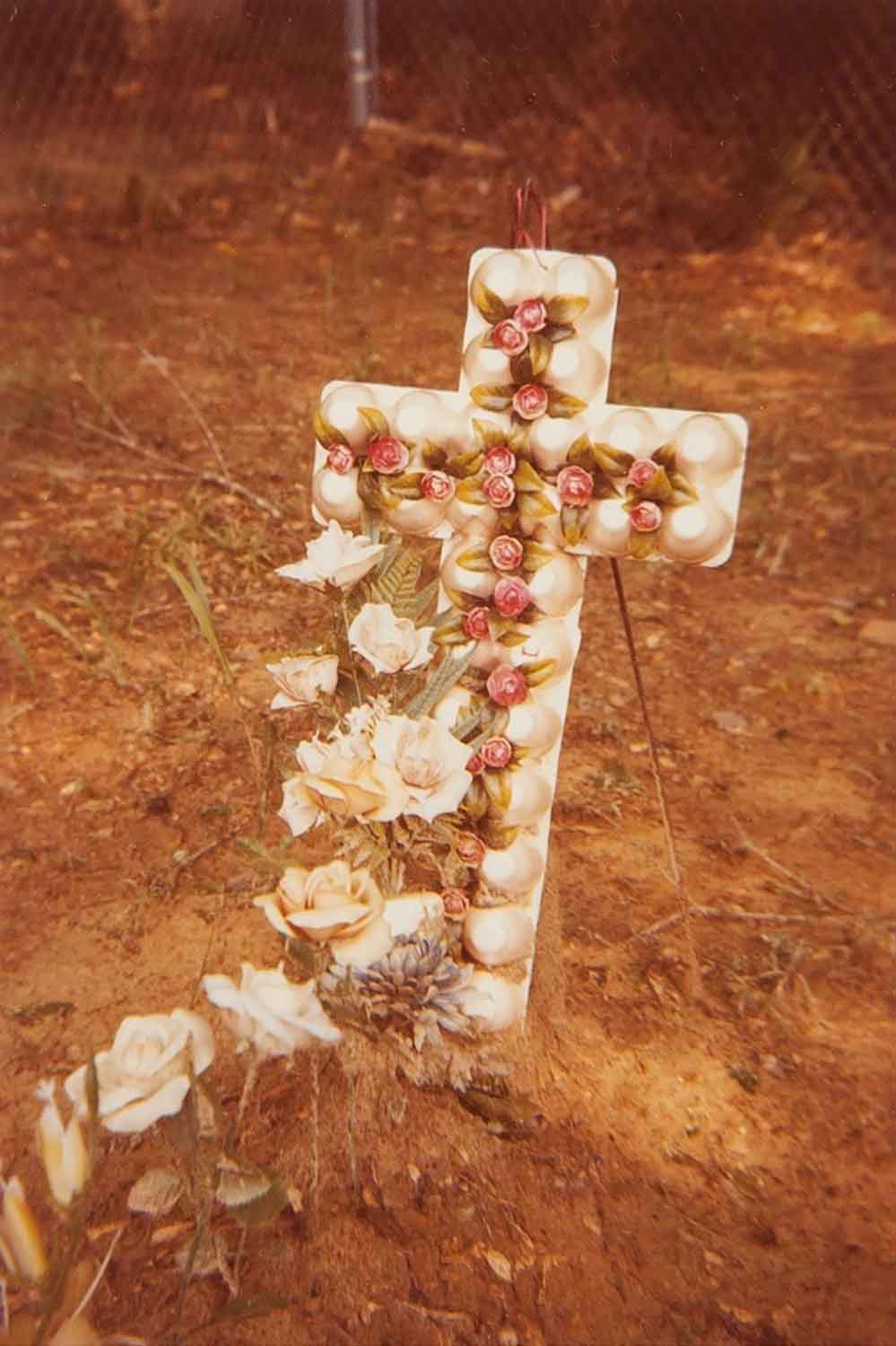   Grave with Egg Carton Cross, Hale County, Alabama  Image: 1975/printed: 1981 Dye Coupler Color Print 4 3/4 x 3 1/4 in. (image size) The Do Good Fund, Inc., 2016-117 