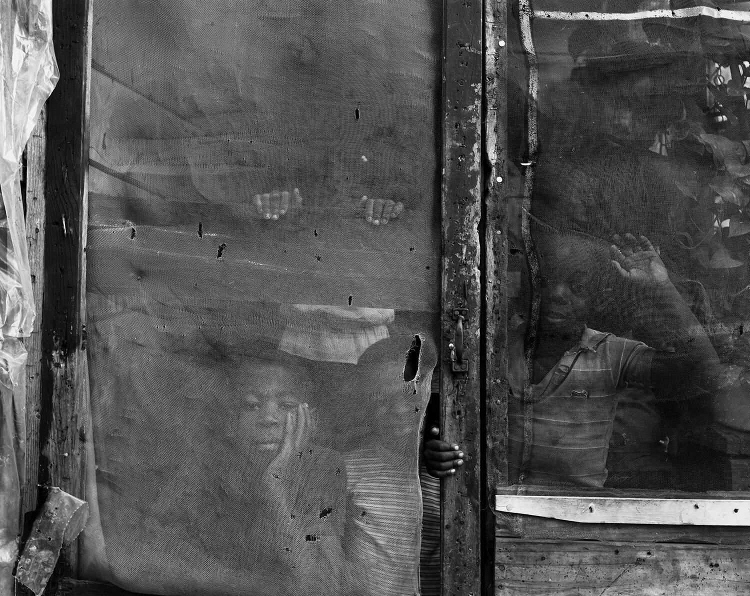   Children Behind Screen Door, Rosedale, MS , 1986 Archival pigment print  15 × 19 in. (image size) The Do Good Fund, Inc., 2016-28 