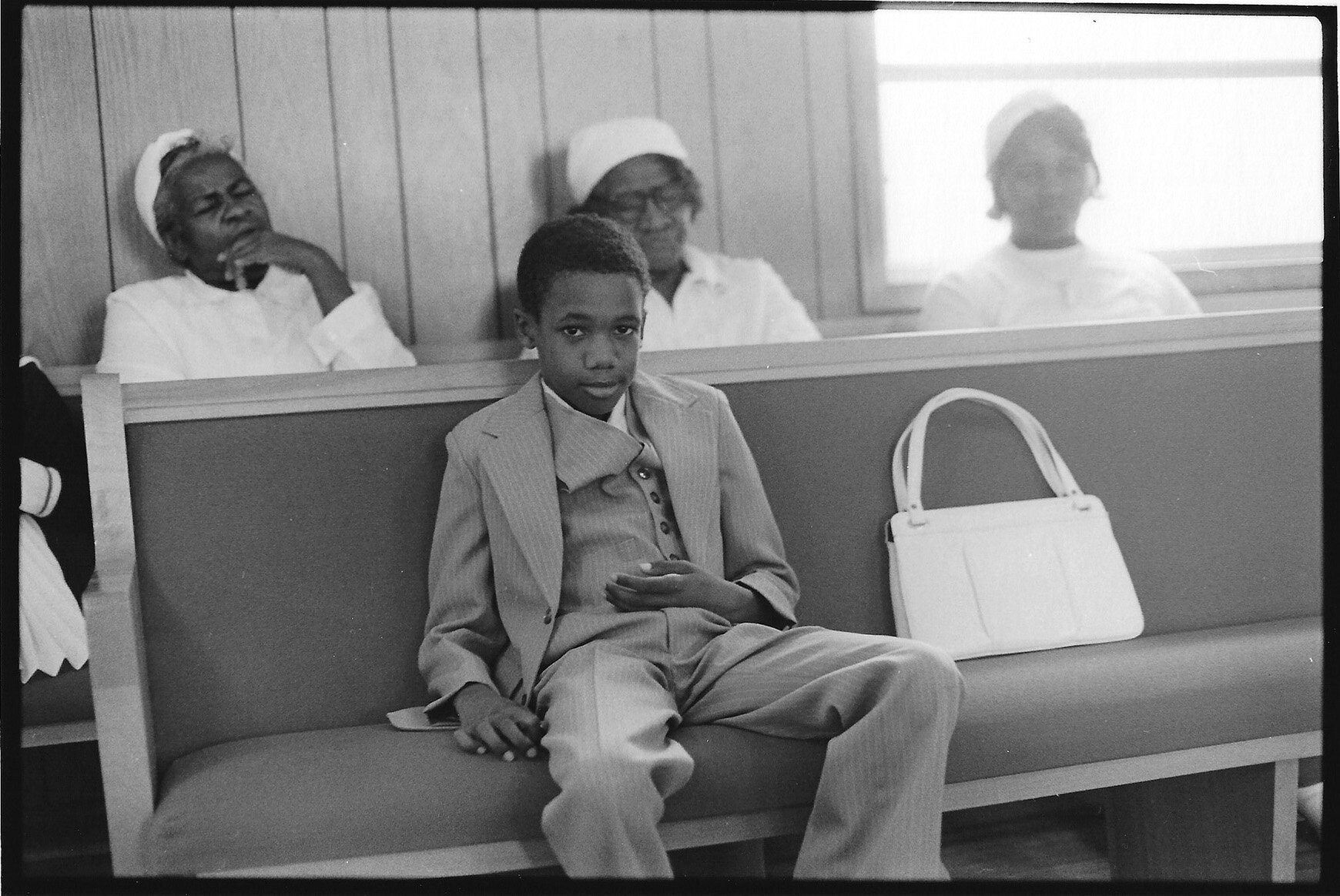   Boy Guarding Purse, Dry Springs African Methodist Episcopal Church, Climax, GA  Image: 1979/printed: 2020   Gelatin silver print 5 1⁄4 x 7 3⁄4 in. (image size) The Do Good Fund, Inc.,2020-041 
