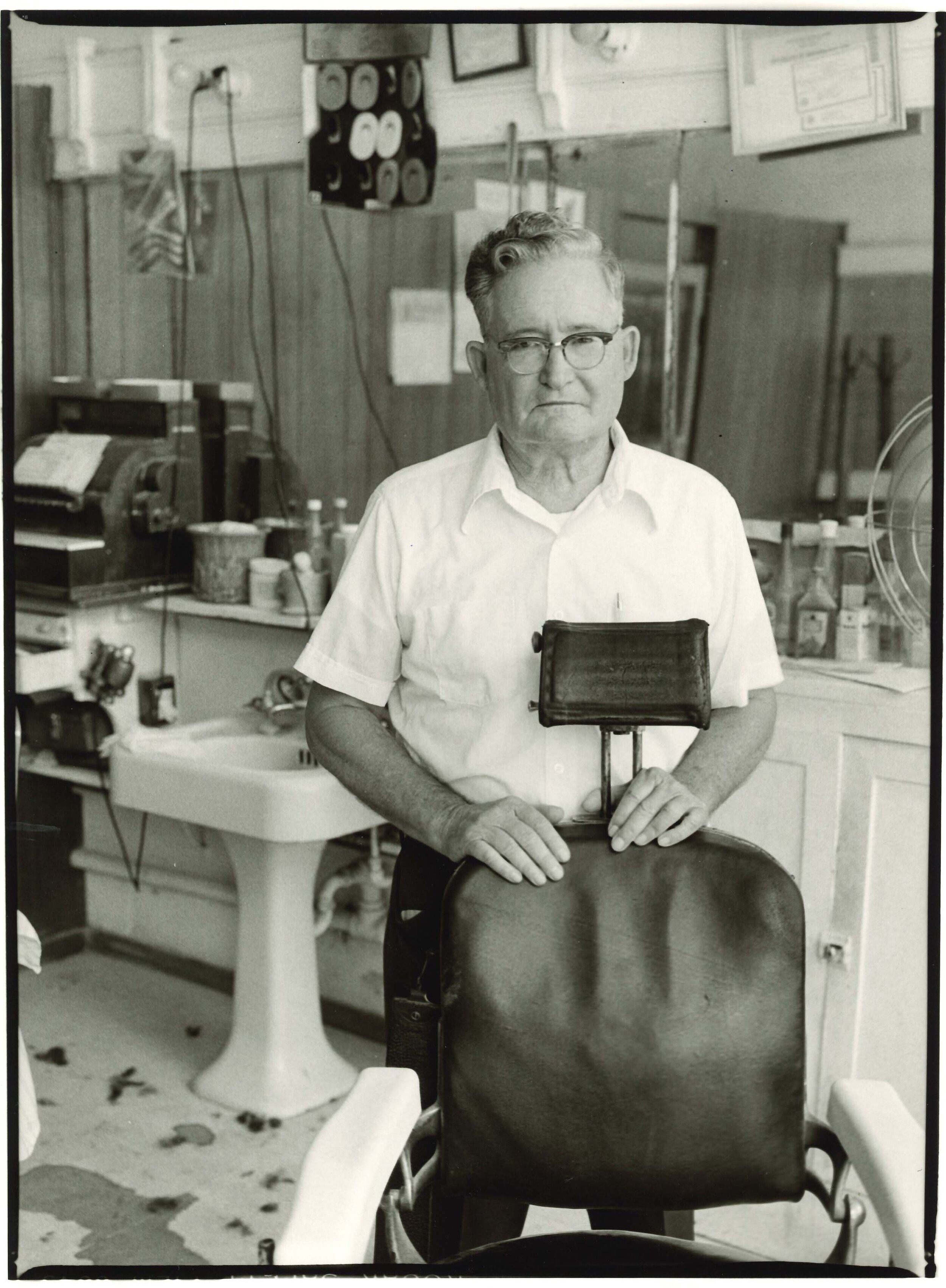   Mr. Dodson Inside the Bon-Aire Barber Shop, 312 Water St., Bainbridge, GA , 1980 Gelatin silver print 12 x 8 3/4 in. (image size)  The Do Good Fund, Inc., 2020-069 