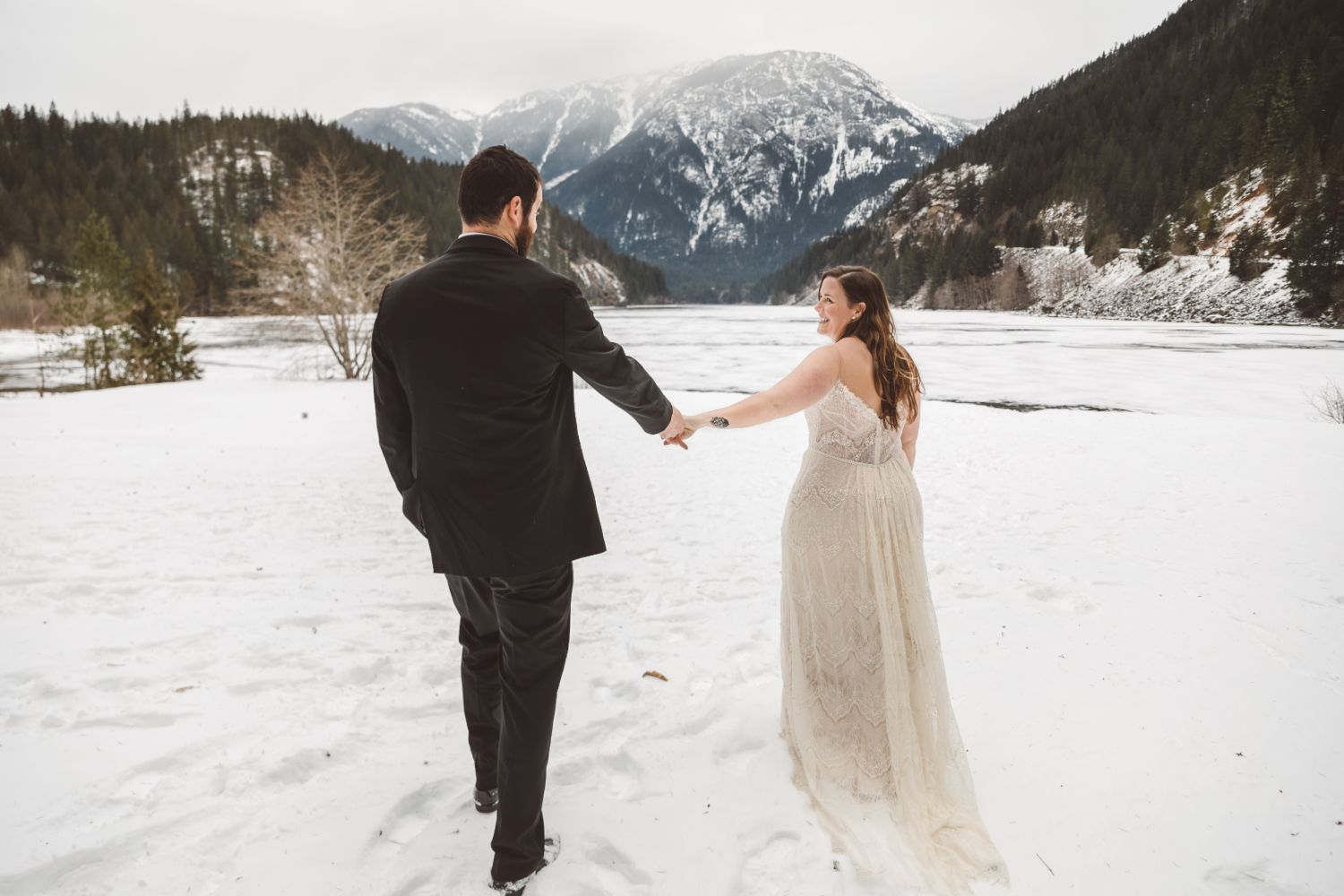 married-couple-hold-hands-north-cascades-adventure-elopement