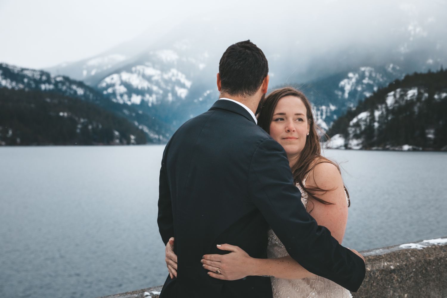bride-groom-take-in-snowy-mountain-view