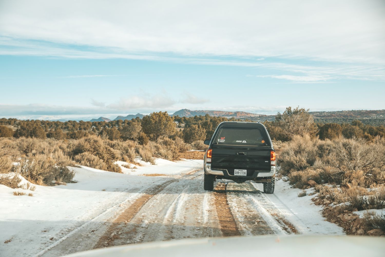 truck-drives-backroad-snow