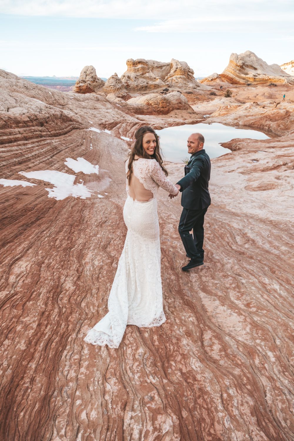 couple-hold-hands-utah-desert-adventure-wedding