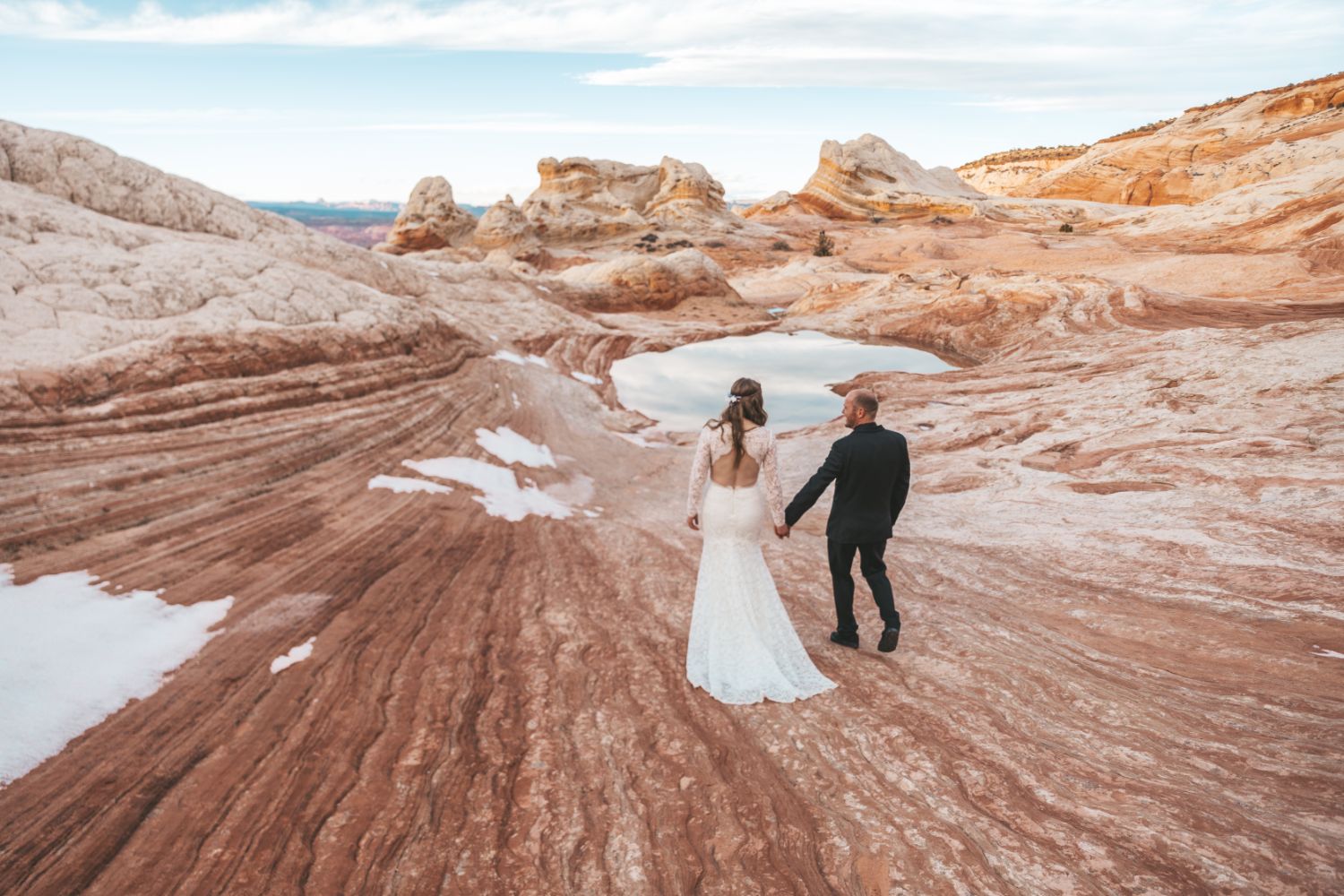 couple-hold-hands-utah-desert-adventure-wedding