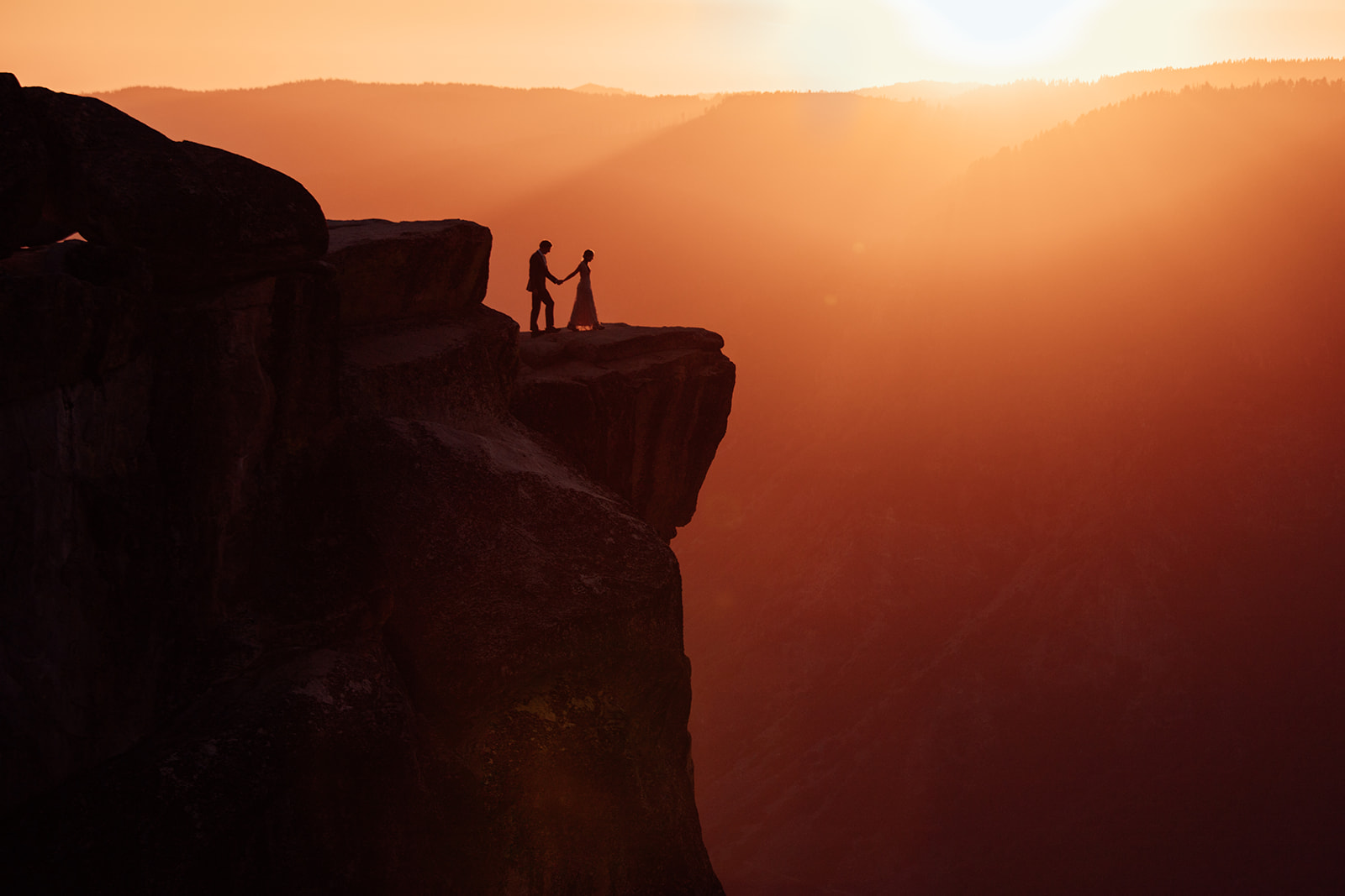 couple-walk-to-cliff-edge-elopement