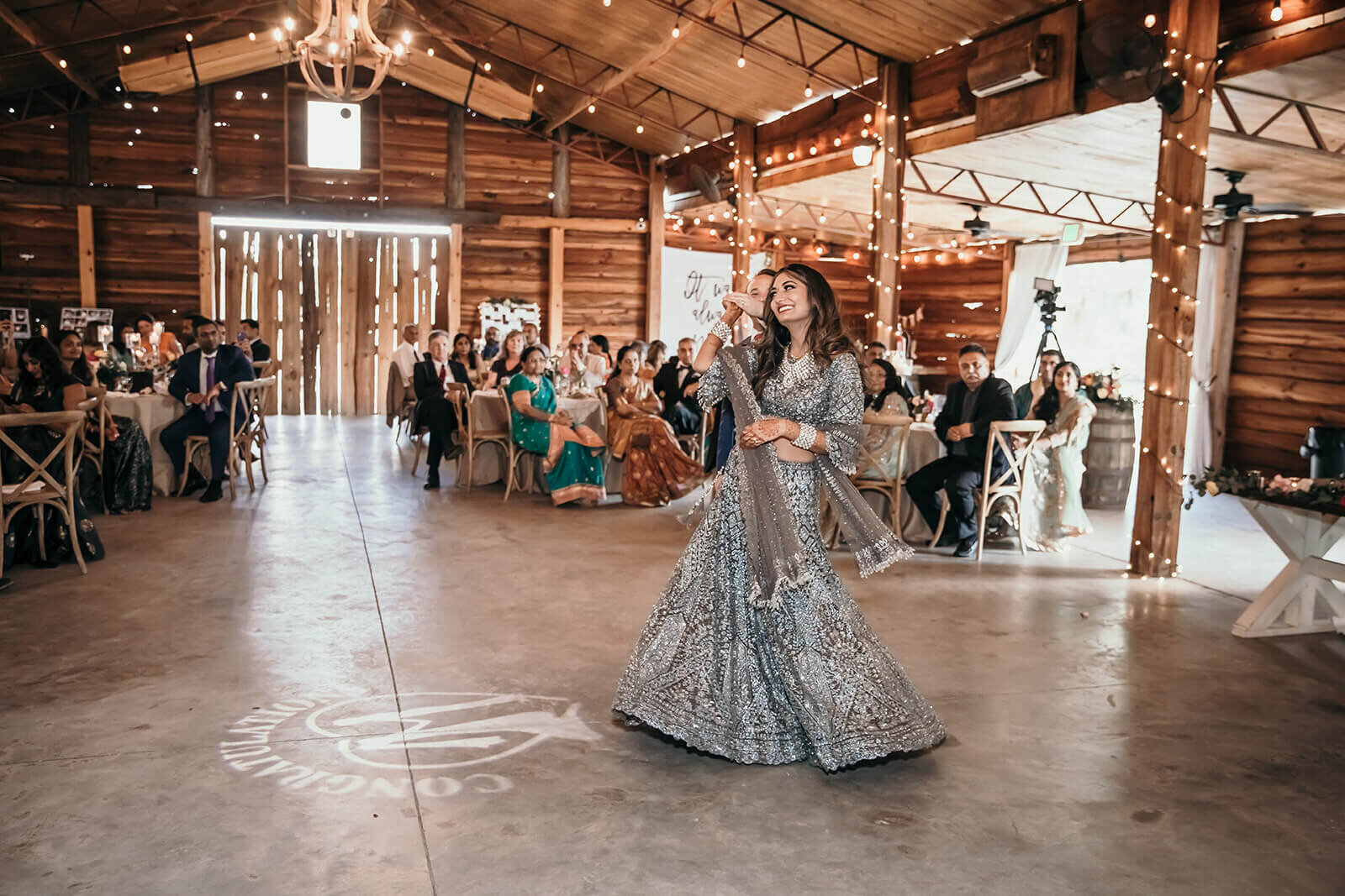  Bride and grooms dancing entrance into the barn to start the reception 