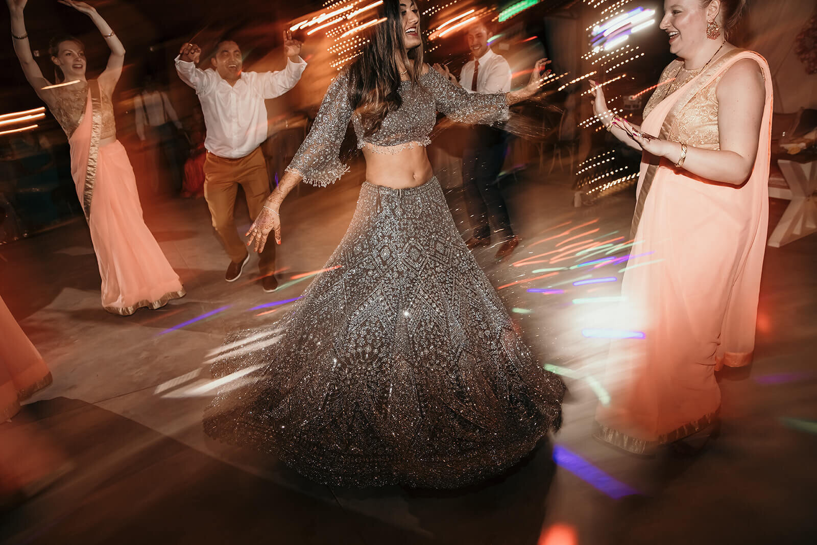  The bride twirls in her beautiful, sparkly reception dress as this Florida Rustic Barn wedding 