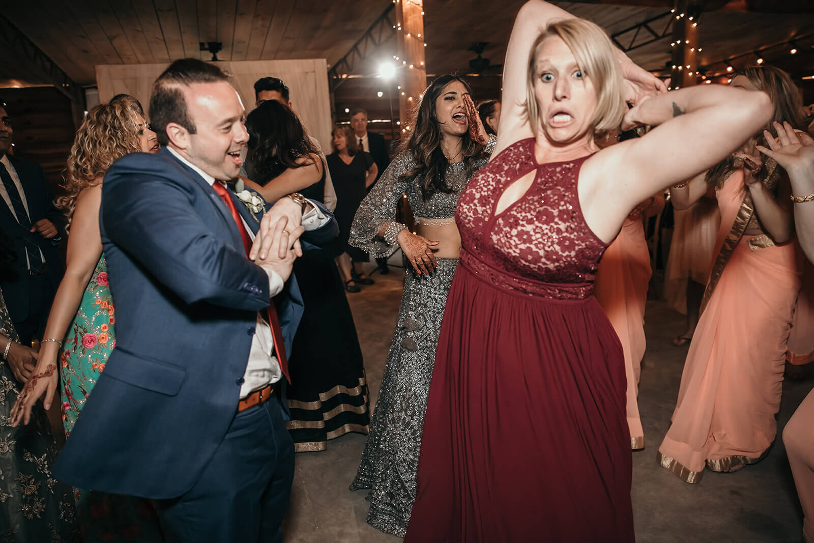  Groom dances with a family member 