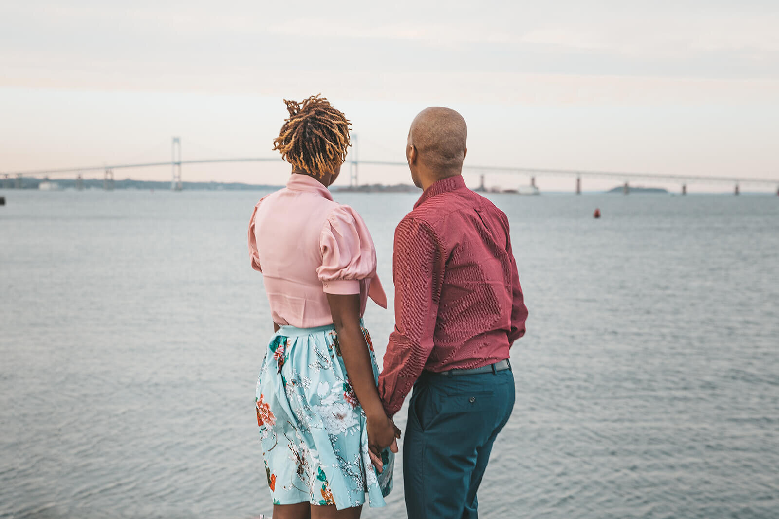  Couple looking at the Newport bridge at Fort Adams State Park 