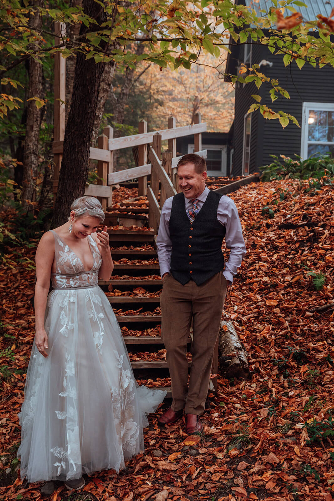  Eloping couple share first look in the early morning at a cabin during fall in Vermont 