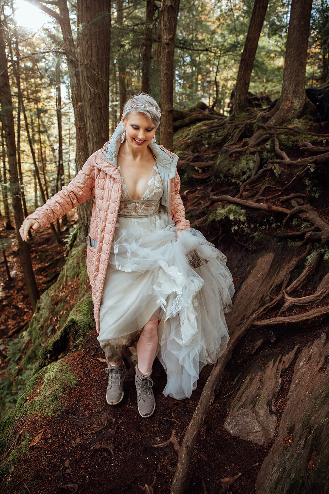  Bride gets her dress muddy hiking to her ceremony spot at Warren Falls in Vermont 