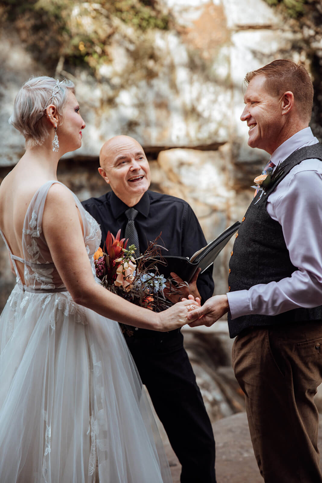  Officiant marries bride and groom at Warren Falls, VT 