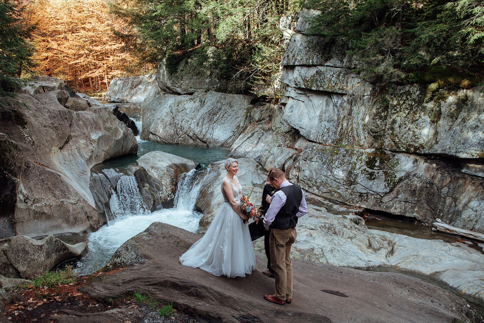  Elopement ceremony performed at Warren Falls, VT during peak autumn foliage 