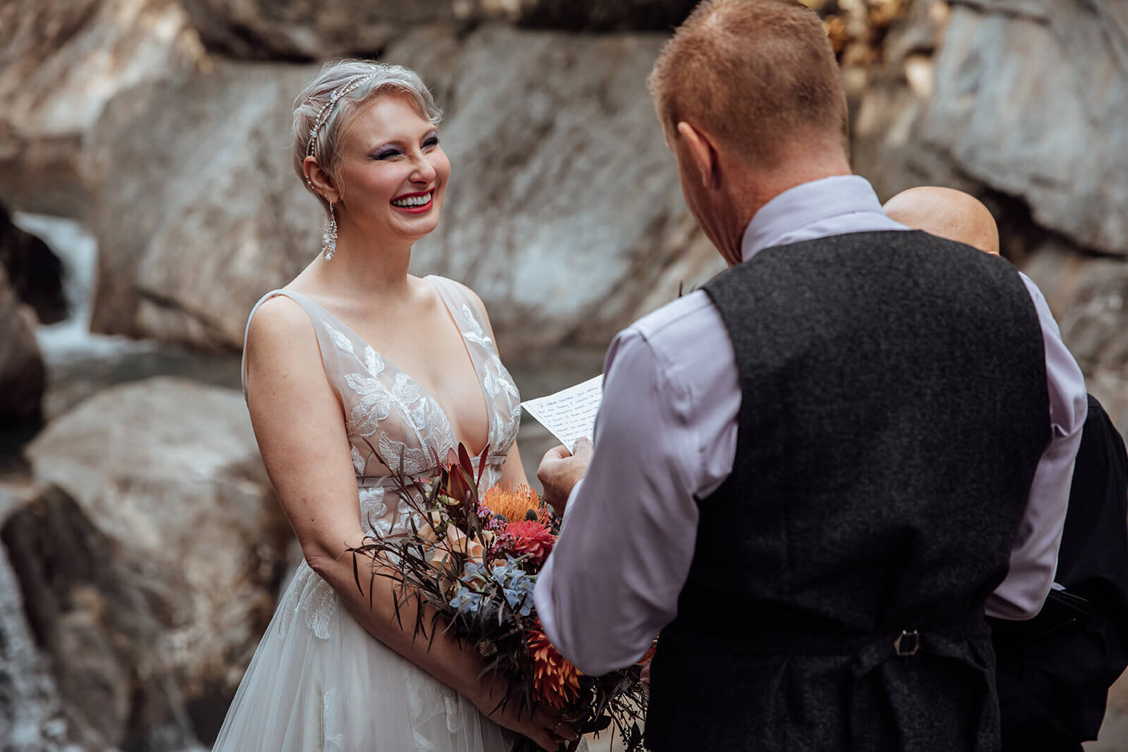  Bride reacts to grooms vows at Warren Falls, VT 