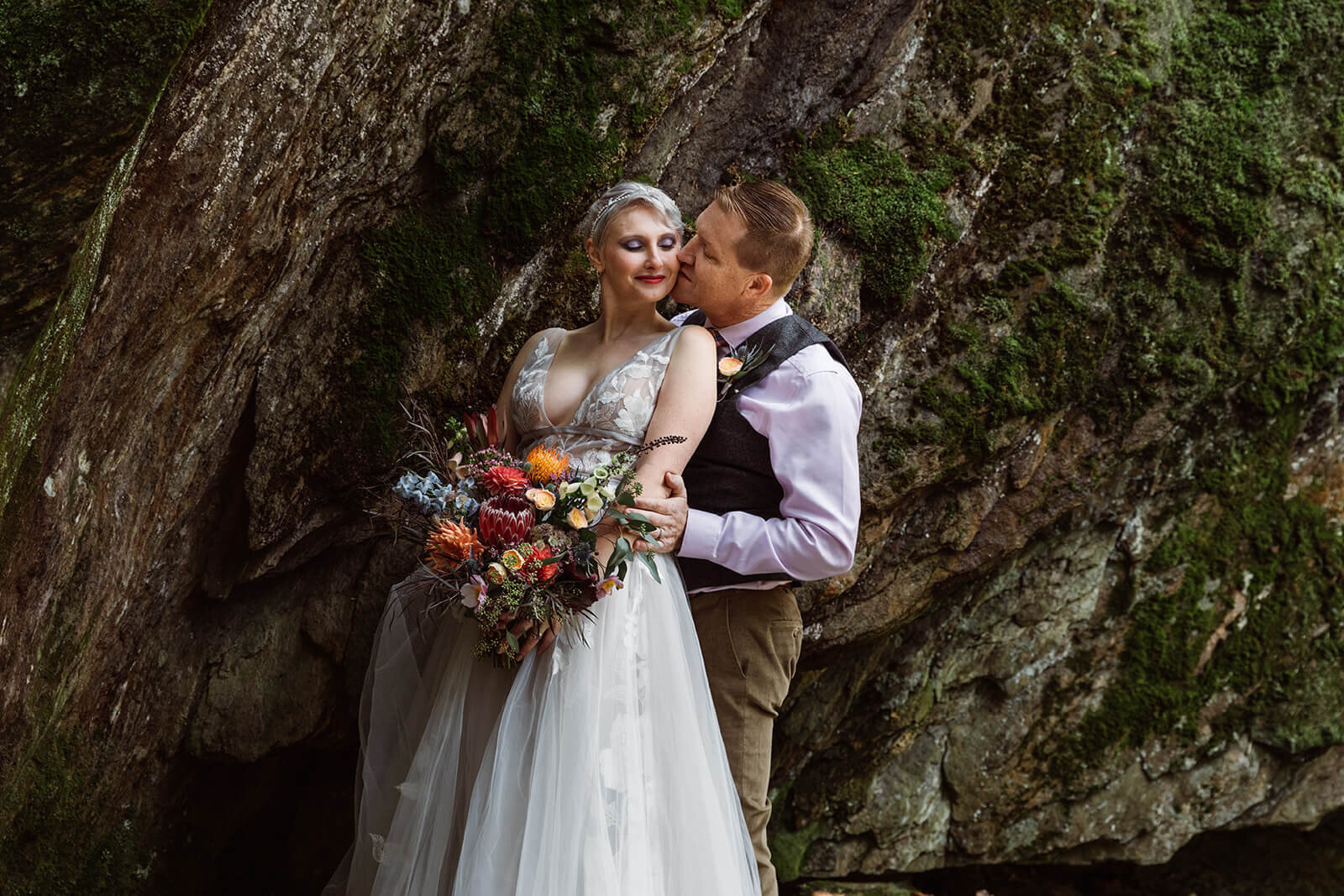  Groom kisses bride after their Warren Falls, VT elopement 