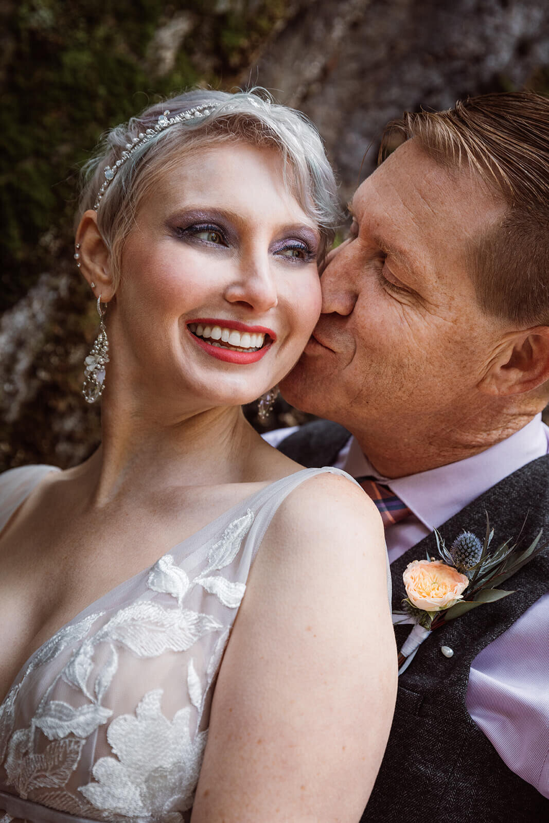  Groom kisses bride after their Warren Falls, VT elopement 