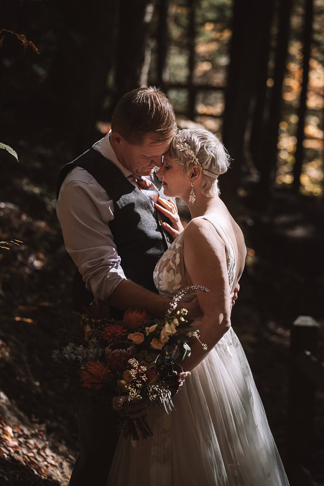  Bride and groom share an intimate moment at Texas Falls Recreation Area in Vermont after their elopement 