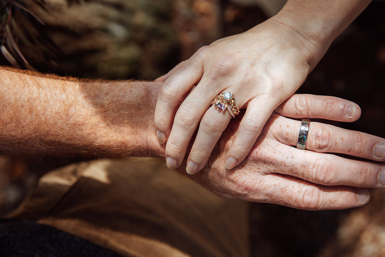  Bride and groom show off unique rings during their outdoor wedding in Vermont 